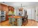 Traditional kitchen featuring custom wood cabinets, granite countertops, stainless steel appliances, and a central island with bar seating at 2702 Long Lake Ne Ter, Roswell, GA 30075