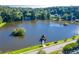 Scenic lake view with a gazebo on a small island, surrounded by trees and green grass at 2702 Long Lake Ne Ter, Roswell, GA 30075