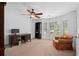 Home office space includes a desk, shelving, and seating area offering functionality and views outside at 2702 Long Lake Ne Ter, Roswell, GA 30075