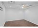 This room features a ceiling fan and dark hardwood floors at 2702 Long Lake Ne Ter, Roswell, GA 30075