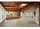 A covered porch with wood ceiling, beams and a view of nature through the screens at 2702 Long Lake Ne Ter, Roswell, GA 30075