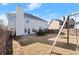 Expansive backyard featuring a swing set, a trampoline, and ample space for outdoor fun and recreation at 5040 Mundy Ct, Cumming, GA 30028