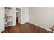 Bedroom with wood floors features a closet and access to the en suite bathroom at 5040 Mundy Ct, Cumming, GA 30028