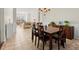 Spacious dining area features a wooden table with seating and plenty of room for entertaining at 5040 Mundy Ct, Cumming, GA 30028
