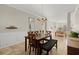 Elegant dining area boasts a wooden table, chandelier lighting, and an inviting atmosphere at 5040 Mundy Ct, Cumming, GA 30028