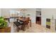 Charming dining room with a wooden table, chandelier lighting, and easy access to the kitchen at 5040 Mundy Ct, Cumming, GA 30028