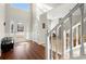 Bright, airy foyer with lots of natural light, hardwood floors, and a beautiful staircase at 5040 Mundy Ct, Cumming, GA 30028