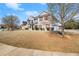 Lovely two-story home with a well-maintained front yard and attractive landscaping at 5040 Mundy Ct, Cumming, GA 30028