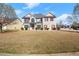 Beautiful two-story home featuring a spacious front lawn and inviting curb appeal at 5040 Mundy Ct, Cumming, GA 30028