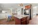 Kitchen with a central island, eat-in dining area, and an open layout to the living space at 5040 Mundy Ct, Cumming, GA 30028