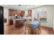 Eat-in kitchen featuring an island, stainless appliances, and dining area near window at 5040 Mundy Ct, Cumming, GA 30028