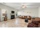 Inviting living room with fireplace, ceiling fan, and comfortable seating at 5040 Mundy Ct, Cumming, GA 30028