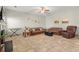 Spacious living room with neutral tile flooring, fireplace, and cozy furniture at 5040 Mundy Ct, Cumming, GA 30028