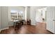 Comfortable office with wood floors, bright window, and double doors leading to the entry area at 5040 Mundy Ct, Cumming, GA 30028