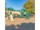 Community playground with slide, climbing area, and overhead covering for  at 6320 Rutherford Pl, Suwanee, GA 30024