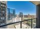 Balcony view of the city skyline from a high-rise building with a glass railing at 1280 W Peachtree Nw St # 2601, Atlanta, GA 30309