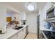 Modern kitchen featuring white cabinets, stainless steel appliances, and stylish quartz countertops at 1280 W Peachtree Nw St # 2601, Atlanta, GA 30309