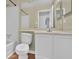Bathroom featuring white vanity, toilet, and shower with tile surround at 3954 Springleaf Pt, Stone Mountain, GA 30083