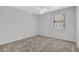 Bright bedroom with carpet flooring, a ceiling fan, and a window at 3954 Springleaf Pt, Stone Mountain, GA 30083