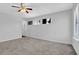 Spacious bedroom with a ceiling fan and natural light from multiple windows at 3954 Springleaf Pt, Stone Mountain, GA 30083