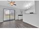 Bright dining area with modern flooring, open to the updated kitchen at 3954 Springleaf Pt, Stone Mountain, GA 30083