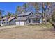 Traditional two-story home featuring a two-car garage and welcoming front porch at 3954 Springleaf Pt, Stone Mountain, GA 30083