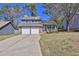Charming two-story home with stone accents and a two-car garage at 3954 Springleaf Pt, Stone Mountain, GA 30083
