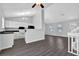 Open-concept living room and kitchen featuring modern appliances at 3954 Springleaf Pt, Stone Mountain, GA 30083