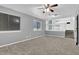 Spacious living room filled with natural light and a view of the kitchen at 3954 Springleaf Pt, Stone Mountain, GA 30083