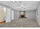 Living room featuring a ceiling fan and fireplace at 3954 Springleaf Pt, Stone Mountain, GA 30083