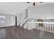 Bright open-concept living space with hardwood floors and a cozy fireplace at 3954 Springleaf Pt, Stone Mountain, GA 30083