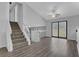 Open living space with stairs, wood-look floors, and vaulted ceilings at 3954 Springleaf Pt, Stone Mountain, GA 30083