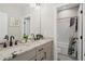 Modern bathroom with double sinks, granite countertops, and a shower-tub combo at 2046 Drew Dr, Atlanta, GA 30318