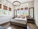 Bright bedroom with high ceilings, large windows, decorative shades, and modern furnishings at 405 9Th Ne St, Atlanta, GA 30309