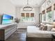 Airy bedroom with tall windows, modern lighting, and sleek furniture creating a relaxing atmosphere at 405 9Th Ne St, Atlanta, GA 30309