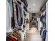 Walk-in closet with custom shelving and ample storage for clothes and accessories at 405 9Th Ne St, Atlanta, GA 30309