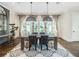 Chic dining room with stylish lighting, hardwood floors, and neutral decor at 405 9Th Ne St, Atlanta, GA 30309