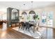 Cozy dining area featuring hardwood floors, modern lighting, and large windows for natural light at 405 9Th Ne St, Atlanta, GA 30309