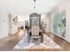 Elegant dining room with hardwood floors, stylish lighting, and a decorative rug at 405 9Th Ne St, Atlanta, GA 30309