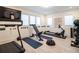 This home gym boasts a treadmill, weight training machines, and a mirrored wall, perfect for staying active at 405 9Th Ne St, Atlanta, GA 30309