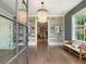 Grand foyer with hardwood floors, built-in shelving, and elegant lighting at 405 9Th Ne St, Atlanta, GA 30309