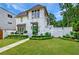 Beautiful two-story home with a manicured lawn and elegant exterior design at 405 9Th Ne St, Atlanta, GA 30309