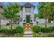 Charming white home featuring a landscaped front yard, wooden gate, and manicured bushes at 405 9Th Ne St, Atlanta, GA 30309