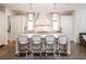 Gorgeous kitchen with an island, pendant lighting, and seating for four at 405 9Th Ne St, Atlanta, GA 30309