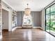 Bright living room with hardwood floors, built-in shelves, and a decorative chandelier at 405 9Th Ne St, Atlanta, GA 30309