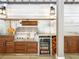 Modern outdoor kitchen features stainless steel appliances, custom cabinetry, and built-in beverage cooler at 405 9Th Ne St, Atlanta, GA 30309
