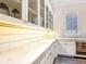 Well-organized pantry with ample cabinet space and a wine refrigerator at 405 9Th Ne St, Atlanta, GA 30309