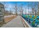 Bicycles lined up on a sidewalk within Piedmont Park near bare trees at 405 9Th Ne St, Atlanta, GA 30309