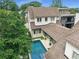 Aerial view of the home's rear exterior with a swimming pool and well-manicured lawn at 405 9Th Ne St, Atlanta, GA 30309