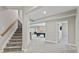 Finished basement with carpet, stairs, and an open space with a pool table, ready for entertainment at 6040 Ashborough Park, Cumming, GA 30040